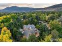 Expansive aerial view of the property showcasing lush landscaping and mountain views at 1107 Juniper Ave, Boulder, CO 80304
