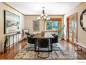 Formal dining room featuring modern light fixture, hardwood floors, and stylish decor at 1107 Juniper Ave, Boulder, CO 80304