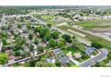 Expansive aerial view of the neighborhood, showcasing the green spaces, roads, and surrounding community features at 1111 Wabash St, Denver, CO 80220