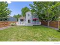 Spacious backyard with a well-maintained lawn and patio perfect for outdoor entertaining and relaxation at 1667 Reliance Cir, Superior, CO 80027