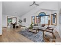 Bright and airy living room featuring vaulted ceilings, hardwood floors, and large windows at 1922 15Th Ave, Longmont, CO 80501