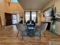 Bright living room with soaring ceilings, hardwood floors, and modern decor at 1931 Rannoch Dr, Longmont, CO 80504
