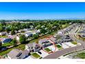 Birds eye view of house with expansive lawns, mature trees and neighborhood, circled in red at 3308 Dryden Pl, Mead, CO 80542