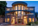 An eye-catching, modern home features large windows and balconies to maximize natural light at 3747 Mountain Laurel Pl, Boulder, CO 80304