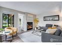 Bright living room with a stylish fireplace, neutral color palette, and comfortable seating, offering a cozy atmosphere at 4763 White Rock Cir # A, Boulder, CO 80301