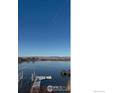 Enjoy this lovely water view with a personal boat dock at 5763 Pelican Shores Dr, Longmont, CO 80504