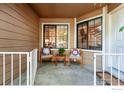 Relaxing outdoor patio with seating and decorative pillows, perfect for enjoying the fresh air at 5920 Gunbarrel Ave # D, Boulder, CO 80301
