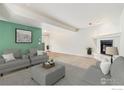 Comfortable living room featuring neutral tones, fireplace, and stylish decor at 911 Tulip St # C, Longmont, CO 80501