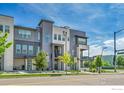 Attractive multi-story townhome featuring modern architecture and landscaping at 1575 W 68Th Ave, Denver, CO 80221