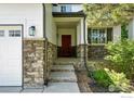 Close up of a lovely front porch with stone accents at 1662 Crestview Ln, Erie, CO 80516