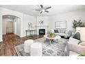 Comfortable living room with a fireplace and neutral decor at 1662 Crestview Ln, Erie, CO 80516