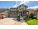 Charming home featuring stone accents, a two-car garage, and well-maintained front yard at 190 Olympia Ave, Longmont, CO 80504