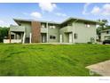 Inviting townhouse with manicured lawn and multiple entryways at 1900 Chalcis Dr # 42, Lafayette, CO 80026