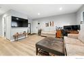 Bright living room with modern furnishings and hardwood flooring at 1900 Chalcis Dr # 42, Lafayette, CO 80026