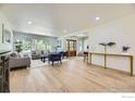 Bright living room with an abundance of natural light, beautiful hardwood flooring, and neutral tones at 2101 Champlain Dr, Boulder, CO 80301
