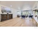 Bright, open-concept living room with hardwood floors, soft neutral tones and generous entertaining space at 2101 Champlain Dr, Boulder, CO 80301