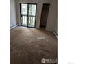 Bedroom with a sliding glass door to a balcony and closet at 2919 Riverside Dr, Idaho Springs, CO 80452