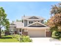 Charming two-story home with attached two-car garage, brick accents, and lush landscaping at 4547 Tally Ho Trl, Boulder, CO 80301