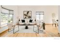 Inviting living room with large windows, hardwood floors, and stylish decor at 4547 Tally Ho Trl, Boulder, CO 80301