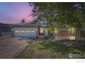 Charming ranch-style home with a brick facade, mature trees, and a two-car garage at 540 Ithaca Dr, Boulder, CO 80305