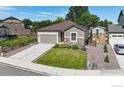 Inviting single-Gathering home with a manicured lawn, charming fence, and two-car garage at 982 Blue Bell Rd, Berthoud, CO 80513