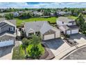 A lovely aerial shot of a single-Gathering home featuring a spacious three-car garage and backyard at 13586 Raritan St, Westminster, CO 80234
