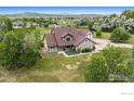 Picturesque home on a sprawling lot with lush landscaping and stunning mountain views at 1625 Green Ridge Rd, Berthoud, CO 80513