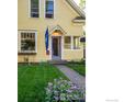 Yellow house with lovely landscaping at 310 Judson St, Longmont, CO 80501