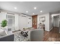 Bright living room with hardwood floors, modern furnishings, natural light, and stylish decor at 3200 S Grape St, Denver, CO 80222