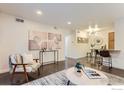 Bright living room with hardwood floors, stylish decor, and a console table with artwork at 3250 Oneal Cir # 10, Boulder, CO 80301
