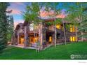 Beautiful home features a stone foundation, multi-level deck, and mountain views at 41 Stillson Placer Ter, Breckenridge, CO 80424