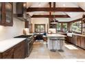 Modern kitchen featuring stainless steel appliances, an island, and a breakfast nook at 41 Stillson Placer Ter, Breckenridge, CO 80424