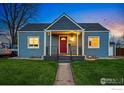 Charming home featuring a covered porch, well-kept lawn, and inviting curb appeal at 4720 Perry St, Denver, CO 80212