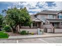 Charming townhouse featuring mature trees, updated siding, and a private fenced-in patio area at 651 Ridgeview Dr, Louisville, CO 80027