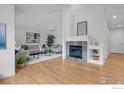 Bright and airy living room with gleaming hardwood floors and a modern fireplace, perfect for relaxation at 651 Ridgeview Dr, Louisville, CO 80027