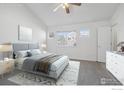 Serene bedroom with a vaulted ceiling, soft carpet, and natural light at 729 Snowberry St, Longmont, CO 80503