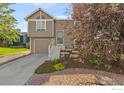 Charming two-story home features a finished garage and beautiful landscaping at 2037 Spencer St, Longmont, CO 80501