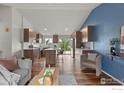 Bright, open-concept living room flows seamlessly into the modern kitchen at 2037 Spencer St, Longmont, CO 80501