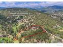 An aerial view with the property line outlined, showing the house's position among the trees at 2794 Linden Dr, Boulder, CO 80304