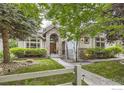 Well-manicured front yard with stone and brick accents at 714 Skywalker Pt, Lafayette, CO 80026