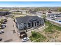 An aerial view of the apartment building surrounded by city amenities and well-maintained grounds at 875 E 78Th Ave # 53, Denver, CO 80229