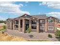 Apartment building's facade featuring a mix of stone and siding finishes and private balconies at 875 E 78Th Ave # 70, Denver, CO 80229