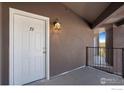 Apartment entrance features well-lit landing, white door with number 72 at 875 E 78Th Ave # 72, Denver, CO 80229