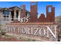 City Horizon monument sign with brick base and decorative metal art at 875 E 78Th Ave # 72, Denver, CO 80229
