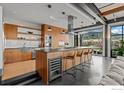 Modern kitchen with stainless steel appliances, wine cooler, and mountain views at 1360 Walnut St # 401, Boulder, CO 80302