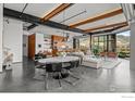 Spacious open-concept living and dining area with modern furnishings and great views at 1360 Walnut St # 401, Boulder, CO 80302