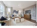 Bright living room with hardwood floors and modern furnishings at 13804 Quartz St, Mead, CO 80504