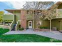 Exterior shot of the home featuring a walkway and stairs leading to the entrance at 1410 Bacchus Dr # B12, Lafayette, CO 80026