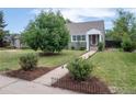 Quaint single-Gathering home with mature trees and a well-kept lawn at 1750 Trenton St, Denver, CO 80220