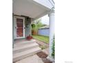 Welcoming front porch featuring classic columns and seasonal decor at 1750 Trenton St, Denver, CO 80220